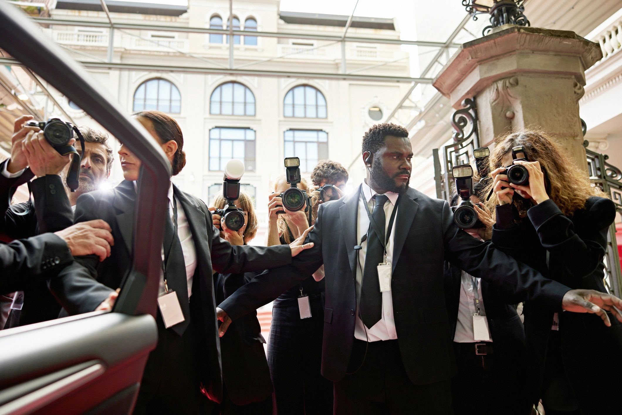 Security staff managing arrivals at an event