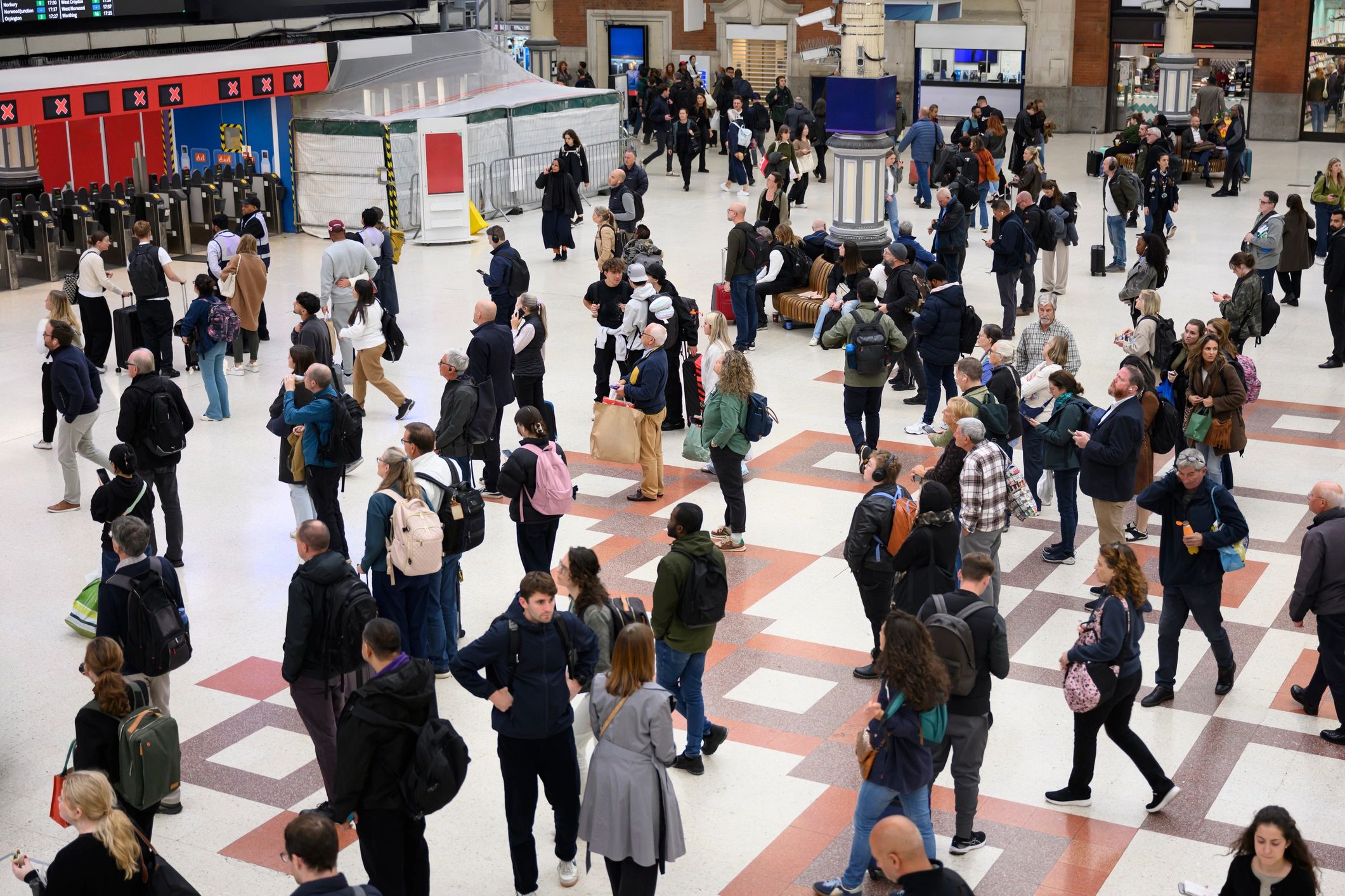 Crowded transit-style venue scene representing crowd management